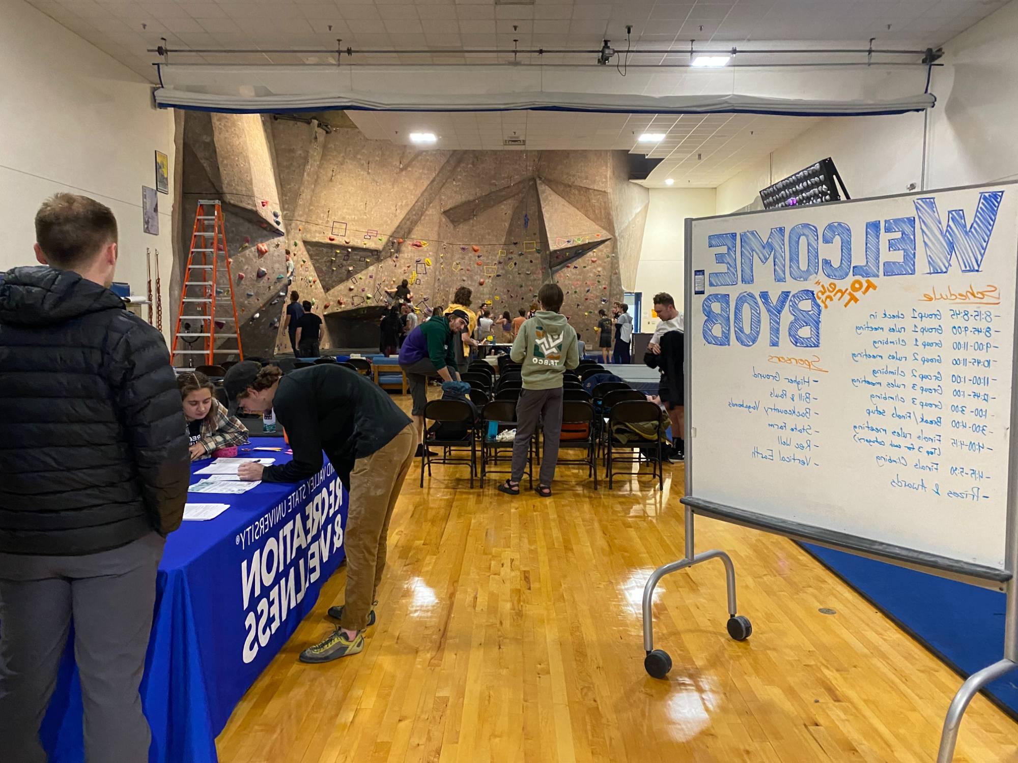 competitors checking-in to bouldering competition